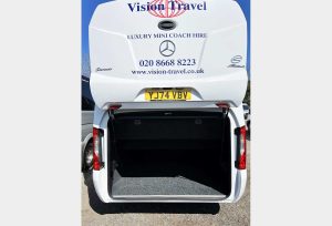Rear view of 22/19 Seater Vehicle with large rear luggage compartment open