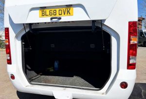Rear view of 29/25 Seater Vehicle with large rear luggage compartment open